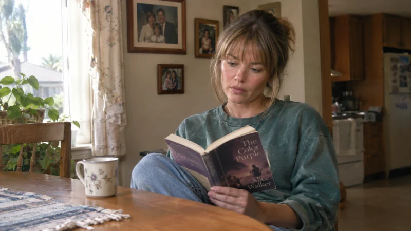 Debra McCurdy seated at a kitchen table in a Southern California home