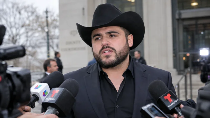 Gerardo Ortiz speaking to reporters outside a federal courthouse